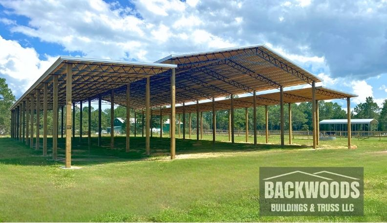 Large-pole-barn-with-leans-hay-barn-backwoods.webp | Backwoods Buildings & Truss LLC what size pole barn do I need? 50x150 open pole barn with lean-tos