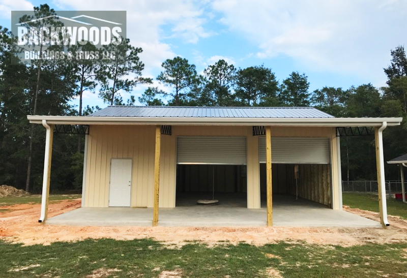 Enclosed pole barn with garage doors installed Florida