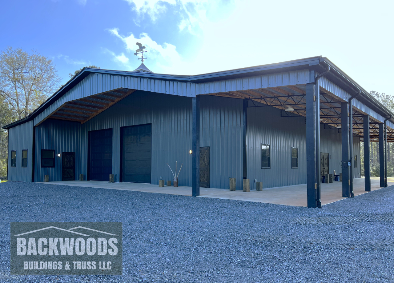 Large enclosed pole barn 8x8 posts with open lean to by Backwoods Buildings
